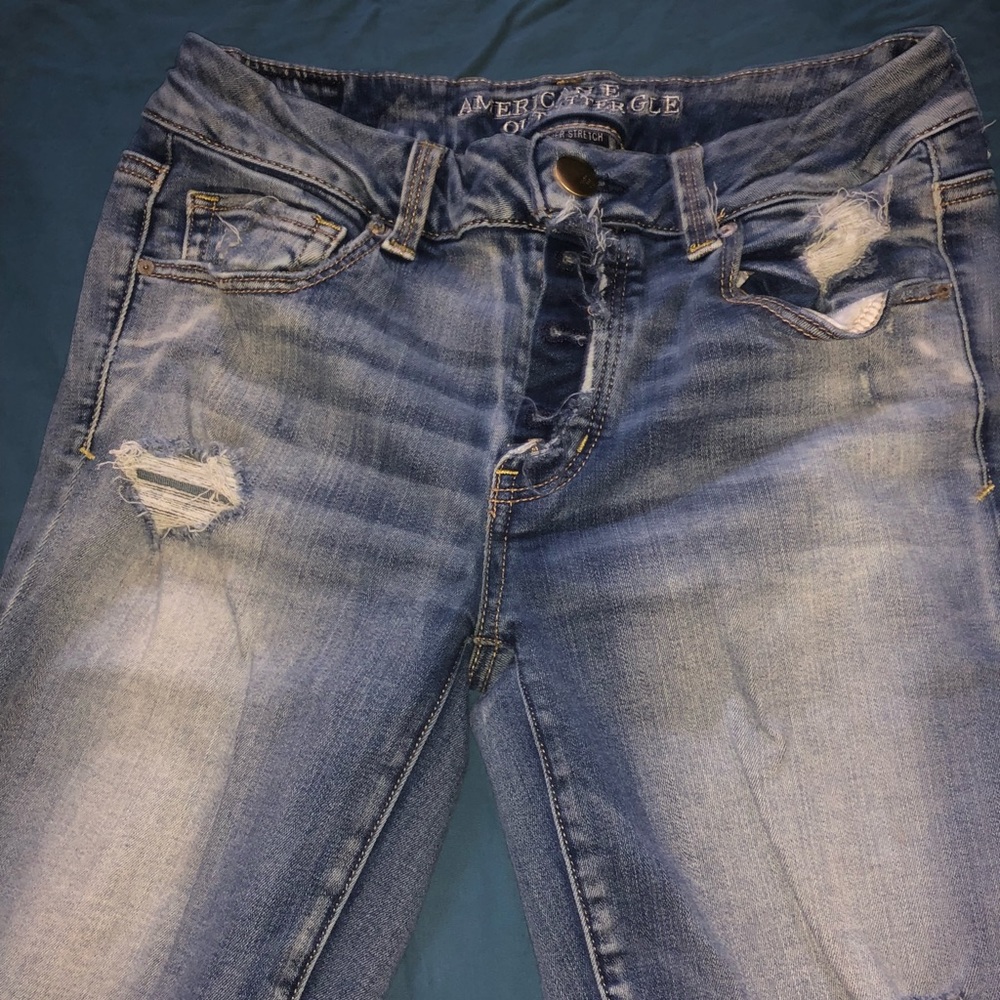 Mid rise, ripped bell bottom AE Jeans
